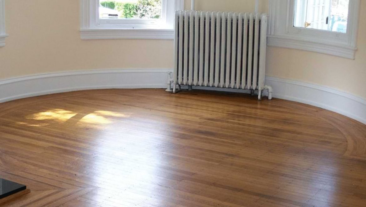 Pergo Vienna Oak and raditor in empty room